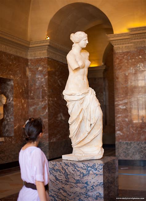 Lone Shooter - A lone tourist admires the Venus de Milo statue at the ...