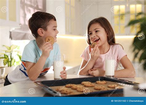 Cute Children Eating Cookies with Milk in Kitchen. Cooking Pastry Stock ...