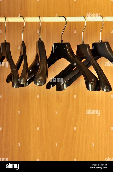 Black hangers in the closet Stock Photo - Alamy