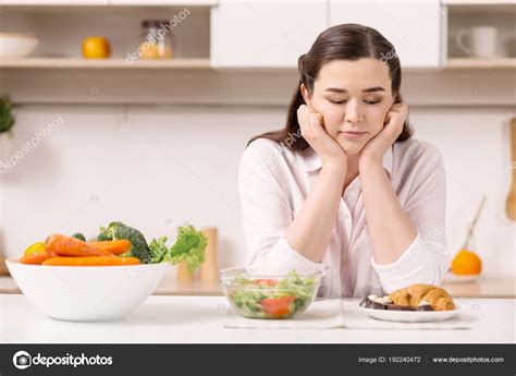 Pensive reflective woman choosing food — Stock Photo © yacobchuk1 ...