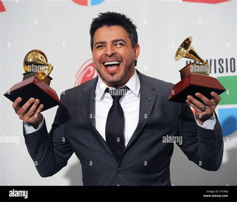 Nicaraguan singer Luis Enrique appears backstage with his awards for ...