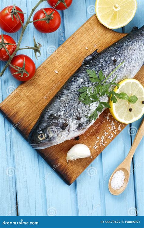 Fresh Raw Fish And Food Ingredients On Table Stock Photo - Image: 56679427