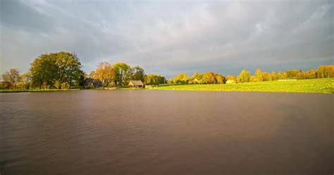 Fast moving clouds on a mainly cloudy day. Timelapse at a tranquil lake., Time Lapse Stock ...