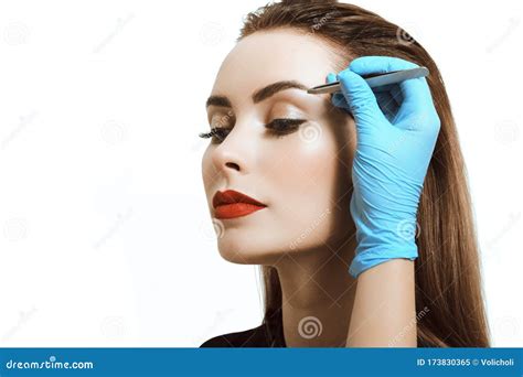 Close-up of a Young Woman Tweezing Eyebrows with Tweezers Stock Image - Image of closeup, female ...