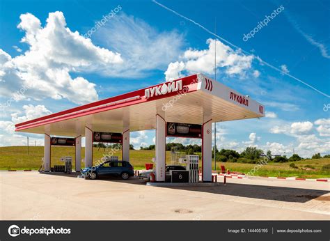 Lukoil gas station with fueling cars – Stock Editorial Photo © blinow61 #144405195