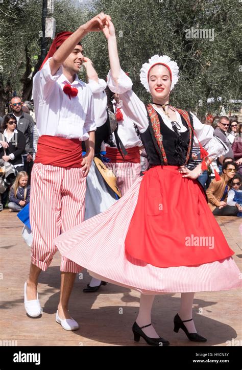 Folk dancers of Nice, France performing a traditional dance of the Alpes-Maritime region in ...