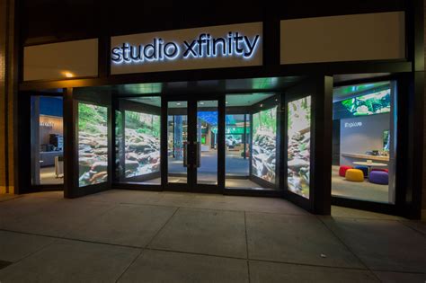 store exterior with LED doorway at Comcast Studio Xfinity store by ESI Design with photography ...