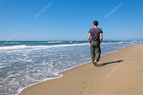 Man walking on the beach — Stock Photo © ueuaphoto #105865560