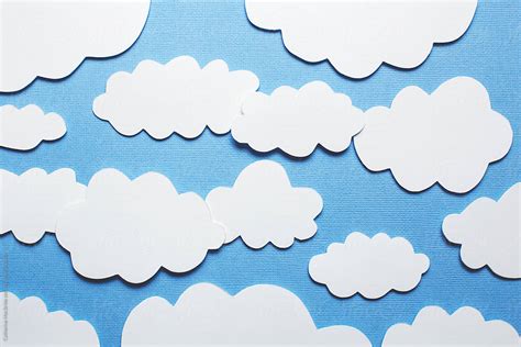 "Paper Craft Fluffy Clouds In A Blue Paper Sky" by Stocksy Contributor "Catherine MacBride ...