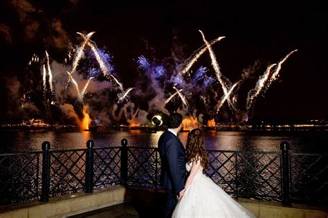 Disney Fairy Tale Wedding couple ending their night with an Epcot fireworks dessert party at ...