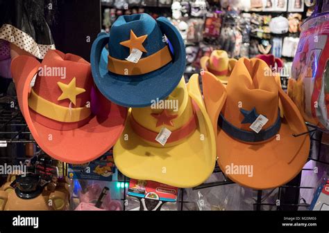 Oversized colorful foam cowboy hats for sale at the Halloween Adventure costume store on ...