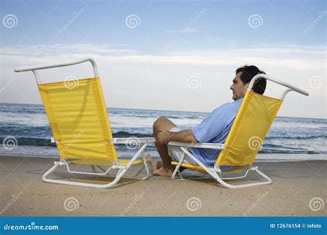 Man Sitting On Beach Alone Stock Images - Image: 12676154