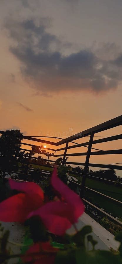 Rooftop Railing Under Cloudy Sky during Orange Sunset Stock Image - Image of orange, vehicle ...