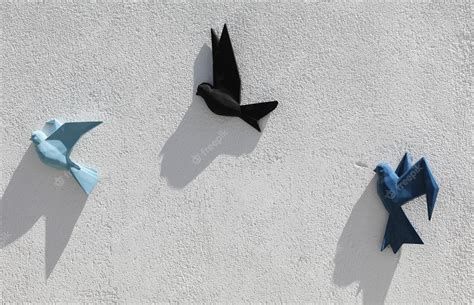 Premium Photo | Decorative flock of birds on white wall