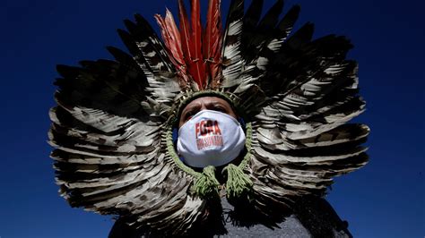 Photo: indigenous man at Jair Bolsonaro impeachment protest in Brazil