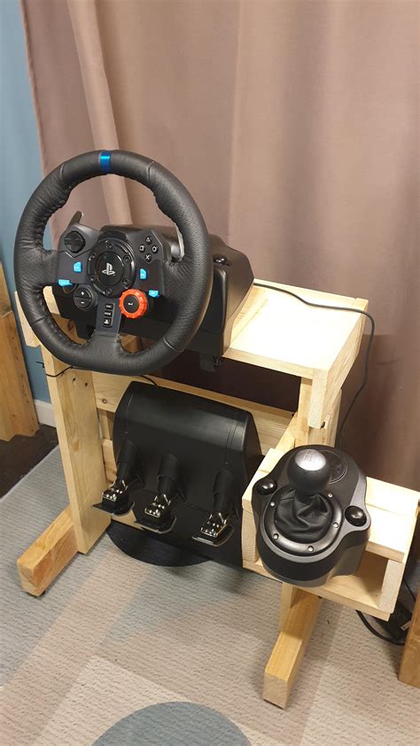 DIY wheel stand made out of wood. Pedals fold up and it's great! Was a better alternative to ...