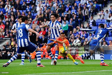 Alexis Sanchez of FC Barcelona scores the opening goal among RCD Espanyol players during the La ...