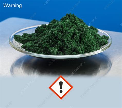 Chromium III chloride and hazard pictogram - Stock Image - C048/9079 - Science Photo Library