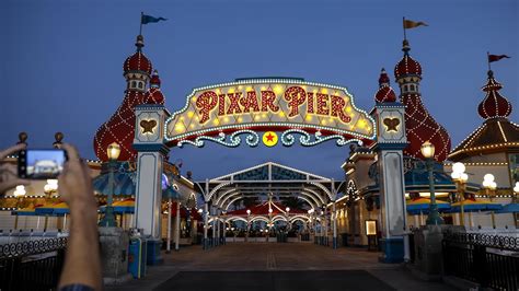 Disney’s California Adventure introduces Pixar Pier - YouTube