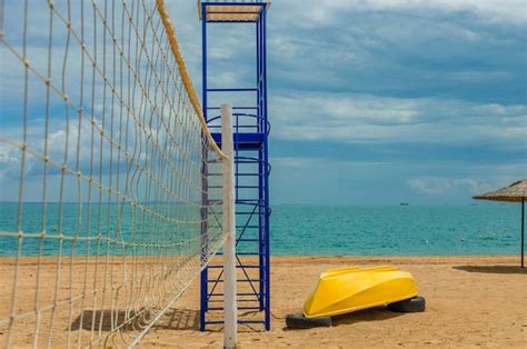 Premium Photo | Volleyball court on the sand near the sea.