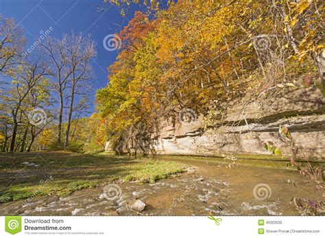 Fall Colors and a Limestone Cliff Over a Quiet Stream. Stock Image - Image of fall, wild: 46322633