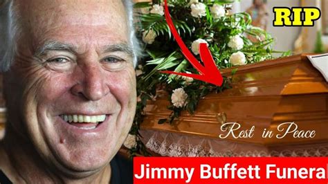 an older man is smiling next to a casket with flowers on it and the ...