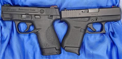 Smith & Wesson Performance Center Shield Versus The TALO Edition Glock ...