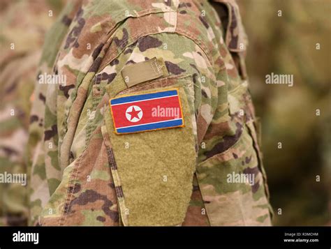 North Korea flag on soldiers arm (collage Stock Photo - Alamy