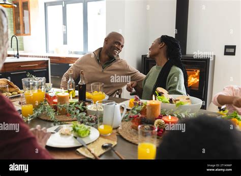 African american parents celebrating at thanksgiving dinner, slow motion. Thanksgiving ...