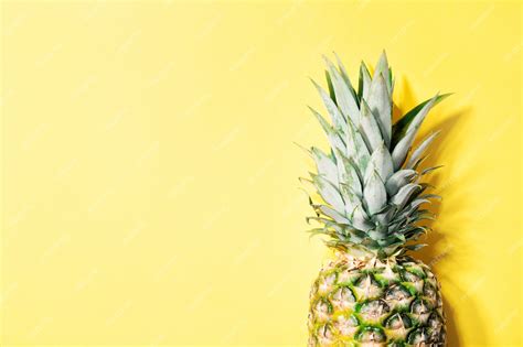 Free Photo | Pineapple on yellow color background