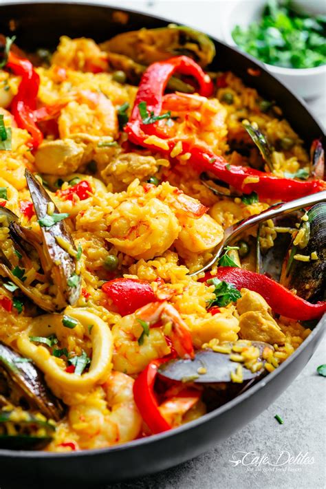 Classic Spanish Paella | https://cafedelites.com | Paella recipe seafood, Paella recipe, Paella ...