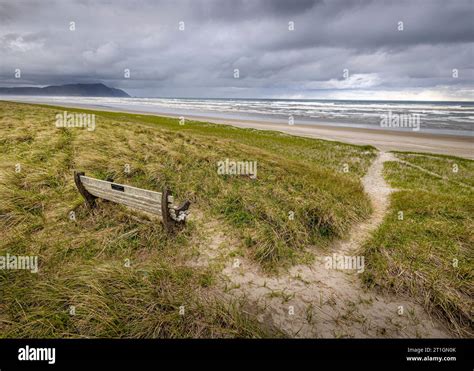 A bench and pathway to the wide open beach of Gearhart on the Oregon ...