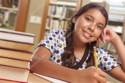 Hispanic Girl Student Studying in Library ⬇ Stock Photo, Image by ...