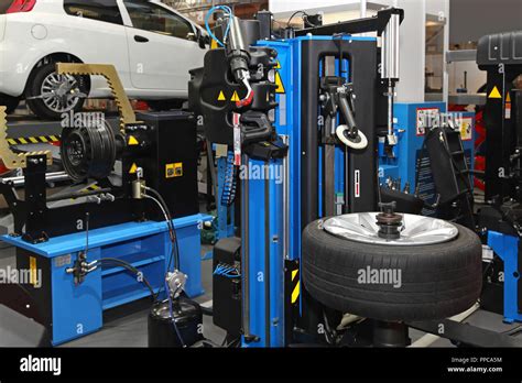 Interior of tyre repair shop service garage Stock Photo - Alamy