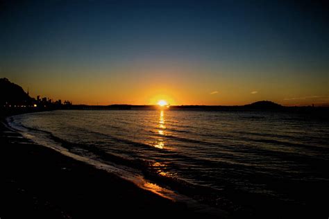 Sunset at Mission Bay, New Zealand Photograph by Jassodra Kuizon - Fine Art America