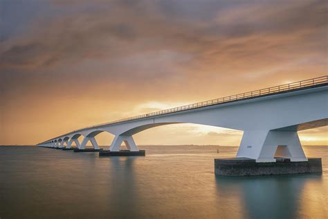 Zeeland bridge at sunrise Photograph by Jenco Van Zalk - Fine Art America