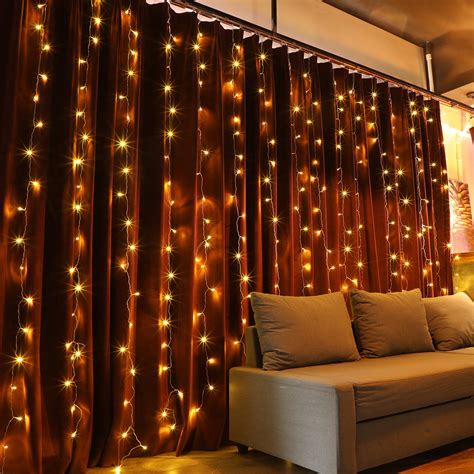 The Holiday Aisle® 320-Light Icicle Fairy String Lights for Christmas Curtain Window Festival ...