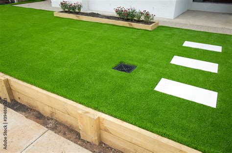 Artificial grass/lawn turf in the front yard of a modern home/residential house. Stock Photo ...