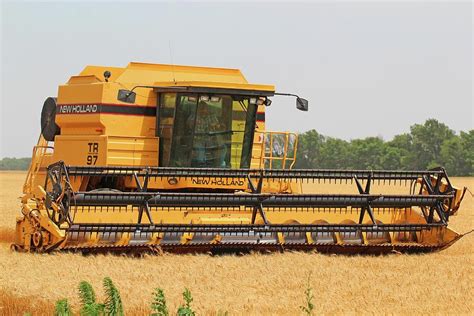 New Holland Combine Photograph by Chris Harris - Pixels