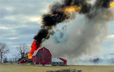 Firefighters battle massive barn fire - mlive.com