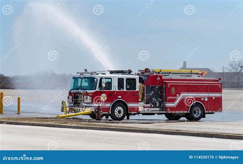 Red Fire Truck in action stock image. Image of water - 114520175