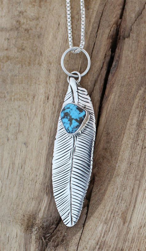 Sterling Silver Feather Pendant with Turquoise Stone