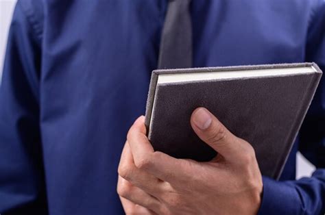 Premium Photo | Man holding book