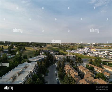 An aerial view of city buildings under a blue sky Stock Photo - Alamy