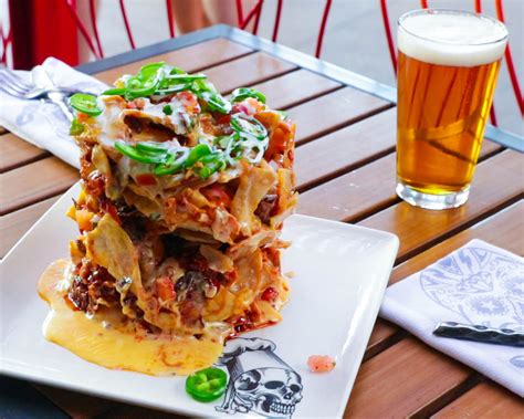 Guy Fieri's Trash Can Nachos Are The Craziest Nachos We've Seen