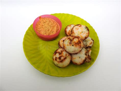 Paddu or Kuzhi Paniyaram and Coconut Chutney in a Green Plate Isolated on White Background ...