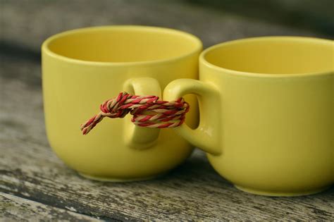 Two Yellow Mugs Tied Together With Rope · Free Stock Photo