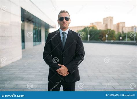 Male Bodyguard in Suit, Earpiece and Sunglasses Stock Photo - Image of ...