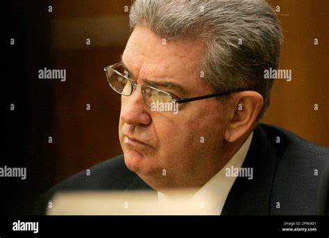 John Connolly, a former FBI agent, listens to testimony from Stephen Flemmi, a jailed Boston mob ...