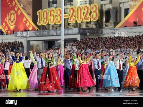 Pyongyang. 27th July, 2023. Young people dance during the military parade at Kim Il Sung Square ...